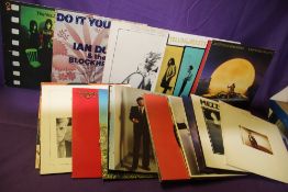 A lot of twenty random albums with titles from Eric Clapton , Asia , Jackson Browne and more on