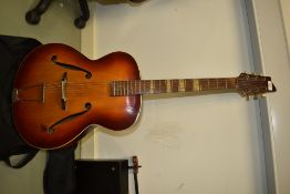 A circa 1950s Framus archtop jazz guitar in a sunburst finish. Neck repair is visible, supplied with