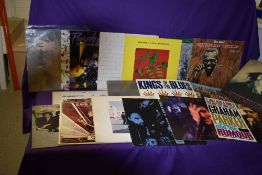 A lot of seventeen albums with titles by Beatles , John Lennon , Howlin' Wolf and more