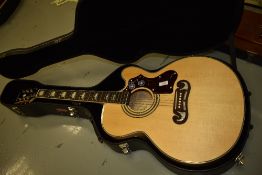 An Epiphone EJ200 SCE in natural, with Stagg Hard case