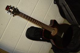 A Columbus Crest electro acoustic guitar