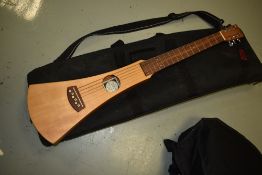 A Martin backpacker travel guitar and bag
