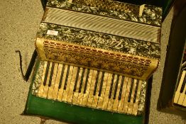 A traditional piano accordion , named Vissimo, in case