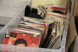 A large lucky dip box of 45's and albums - 1960's and more on offer here - viewing recommended - all