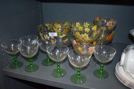 A hand painted sundae dish set and bowls with similar green stem cocktail glasses