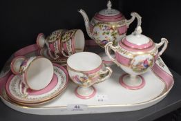 A late 19th/early 20th century breakfast or chocolate set having tray, cups and saucers, handled
