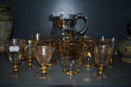 A selection of gilt decorated cocktail glasses including tumbler and decanter set
