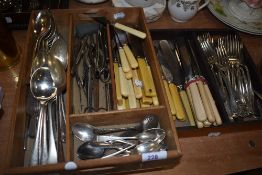 A selection of cutlery and table flatwares including butter knives