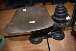 A set of cast kitchen balance scales with weight set