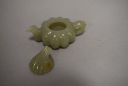 A Chinese sun jade carved miniature tea pot of pumpkin formation.