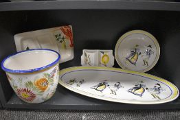A collection of kitchen platters and servers,also a planter including European styles.