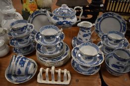 A part tea service in blue and white with Chinese dragon design