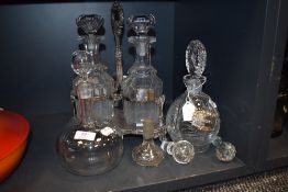 A selection of wine or spirit decanters with decanter stand and also HM silver badges for Sherry and