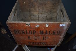 A vintage advertising crate for Dunlop Mackie Bristol