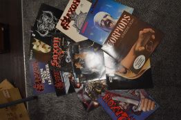 A selection of heavy metal and rock vinyl records also with similar posters kizz iron maiden etc