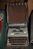 A vintage Olivetti portable type writer.