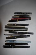 A selection of fountain and ink pens including Parker, Osmiroid and Conway Stewart