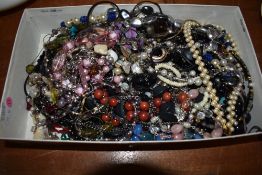 A box full of modern costume jewellery.
