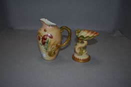 Two pieces of Royal Worcester, a green stamp sea monster and shell comport and a hand decorated