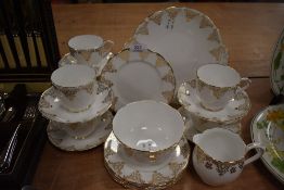 A part tea service by Royal Albert in a gilt on white design