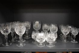 A selection of clear cut crystal glass wares including wine brandy and sherry most by Stuart