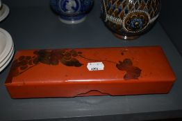 A Japan lacquer glove box or trinket case decorated with bird in foliage
