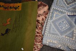 A selection of textiles including patchwork quilt