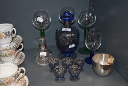 A Venetian blue blown glass decanter and shot set with similar art glass