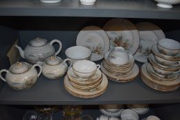 A highly decorated Japanese eggshell china part tea service with mountainous landscape scenes