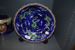 A hand decorated bowl by Coronaware in the (chinese) dragon design S. Hancock & Sons