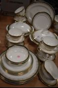 A Royal Grafton partial dinner service 'Majestic' having white ground with green band and gilt