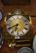 A brass clock face and weight set by Tempus Fugit