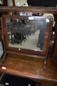 An early 20th Century mahogany toilet mirror