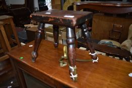 A traditional four legged stool