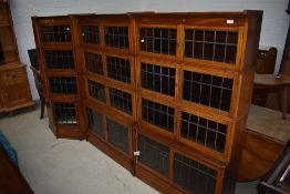 A lovely twelve section run of Edwardian mahogany stacking bookcases comprising two four tier