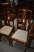 A pair of early 20th Century Queen Anne Style vase back dining chairs with later upholstery