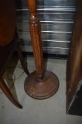 A traditional oak standard lamp