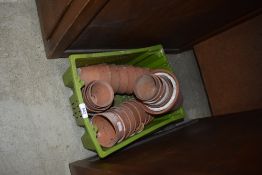A selection of terracotta plant pots, small size