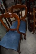 A pair of Victorian mahogany balloon back dining chairs