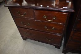 An early 20th Century mahogany chest of drawers in the Georgian style, having drop handles and