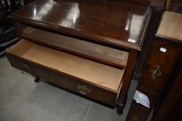 An early 20th Century mahogany chest of three long drawers, locks stamped Waring and Gillows Ltd