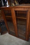 An early 20th Century mahogany and stained frame bookcase