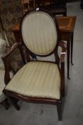 A 19th Century mahogany armchair having shield back