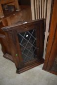 A traditional dark oak corner wall display