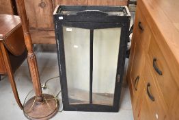 A painted wall cabinet