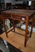 A mahogany and oak side table, in the Arts and Crafts or Shaker style