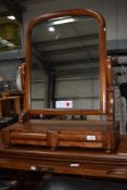 A Victorian mahogany toilet mirror having double drawer base