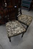 A pair of Victorian ebonised bedroom chairs