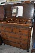A vintage oak 'handy Chest' having fitted interior section bearing labels, patent number 204828