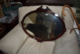 A Victorian mahogany wall mirror having shaped frame